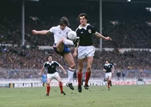 Images Dated 26th May 1979: Englands Dave Watson and Scotlands Joe Jordan