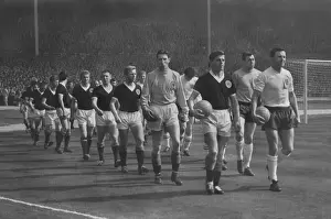 Englands Jimmy Armfield and Scotlands Eric Caldow lead out their teams at Wembley during the 1963 Home Championship