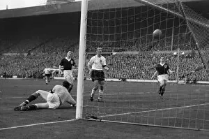 Images Dated 25th November 2009: Englands Jimmy Greaves scores against Scotland in 1961