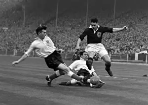 Englands Malcolm Barrass slides in to tackle Billy Liddell - 1952 / 3 British Home Championship