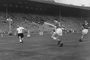Images Dated 13th November 2009: Englands Stanley Matthews crosses the ball against Wales in 1956