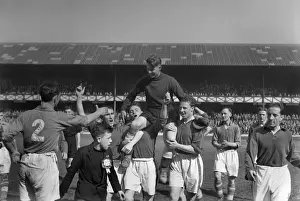 Everton goalkeeper Ted Sagar is chaired off by his teammates after his last game for the club