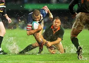 Fabien Galthie attempts to make a break in the rain-soaked 1995 Rugby World Cup semi-final