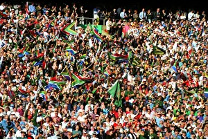 Fans wave the South African flag in the stands at Ellis Park during the 1995 Rugby World Cup Final