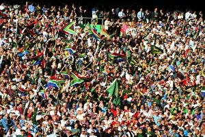 Images Dated 25th July 2012: Fans wave the South African flag in the stands at Ellis Park during the 1995 Rugby World Cup Final