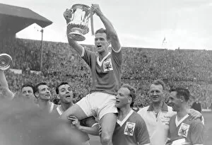 1959 FA Cup Final - Nottingham Forest 2 Luton Town 1 Collection: Forest captain Jack Burkitt lifts the trophy - 1959 FA Cup Final