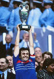 Images Dated 16th January 2012: France captain Michel Platini lifts the trophy at Euro 84