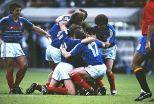 Images Dated 16th January 2012: France captain Michel Platini is mobbed by team mates after scoring his sides opening goal in