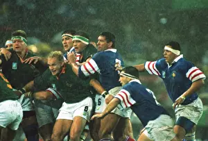 Francois Pienaar holds the line in the rain at the 1995 Rugby World Cup semi-final