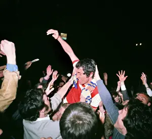 Frank McLintock celebrates with the fans after Arsenal win the 1971 league title
