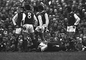 Images Dated 1971: Frank McLintock points the finger at an Ipswich player as Bob Wilson lies injured
