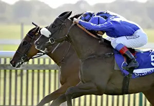 Horse Racing Prints: Frankie Dettori just gets the better of Jamie Spencer to win the 2011 Shadwell Fillies Mile