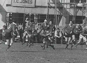 Gareth Edwards passes the ball out to Barry John at Cardiff Arms Park in 1969