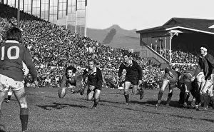 Gareth Edwards passes to Barry John during the second Lions test against the All Blacks in 1971