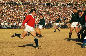 Images Dated 21st October 2011: Gareth Edwards punts ahead for the Lions against South Africa in 1974