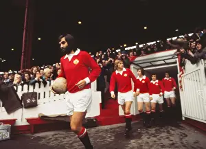George Best leads out Manchester United on his first-team return in 1973