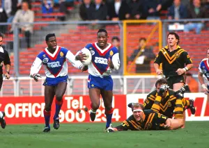 Great Britains Ellery Hanley and Martin Offiah take on Australia