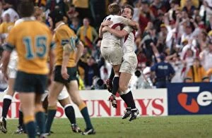 2003 Rugby World Cup Final Collection: Will Greenwood and Jonny Wilkinson hug at the final whistle of the 2003 World Cup Final