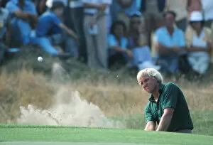 Images Dated 13th July 2010: Greg Norman plays a bunker shot during the 1983 Open Championship