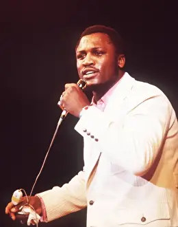 + Heavyweight Boxer Joe Frazier of USA singing during a show in Munich in 1971