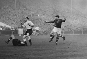 Images Dated 11th March 2010: Hungary goalkeeper Gyula Grosics dives at the feet of Englands Stan Mortensen at Wembley in 1953