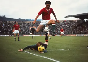 Hungarys Mihaly Kozma leaps over Belgium keeper Christian Piot during Euro 72