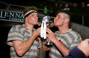 Oxford, Cambridge & The Varsity Match Collection: The Innes Brother kiss the Bowring Bowl after Cambridges victory in the 1998 Varsity Match