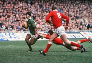 Irelands Michael Bradley makes a break against Wales - 1985 Five Nations