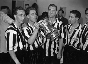 Jackie Milburn and his Newcastle United teammates celebrate their 1955 FA Cup victory
