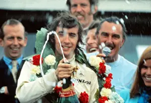 Jackie Stewart celebrates winning the 1969 British Grand Prix