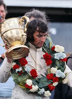 Jackie Stewart with the trophy after winning the 1969 British Grand Prix