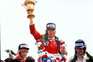 James Hunt lifts the trophy after winning the 1976 British Grand Prix
