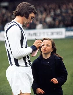 Images Dated 24th April 1971: Jeff Astle signs an autograph for a young West Bromwich Albion fan