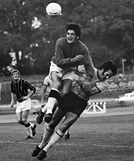 John Jackson wins the ball from George Graham in a 1970 friendly