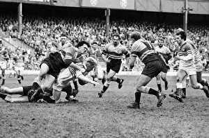 John Jeffrey of the Five Nations is tackled by the Overseas Unions Steve Cutler in 1986