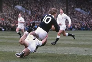 Calcutta Cup Collection: John Rutherford is tackled by Tony Neary - 1980 Five Nations