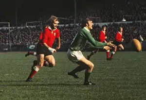 John Taylor puts pressure on John Moloney during the 1973 Five Nations