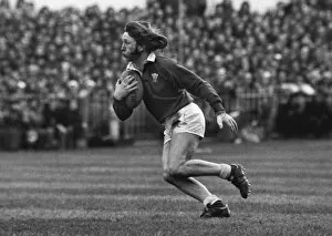 John Collection: JPR Williams runs with the ball during the 1976 Five Nations