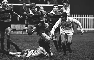 K. Allen runs for Northampton with Cambridges Gerald Davies, right