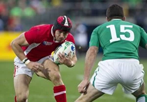 Images Dated 8th October 2011: Leigh Halfpenny runs at Rob Kearney - 2011 Rugby World Cup
