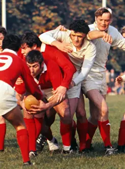 Llanellis Stuart Gallacher competes for the ball with London Welshs Mervyn Davies