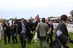 Images Dated 23rd June 2012: Luke Nolan and Black Caviar are surrounded by photographers at Royal Ascot