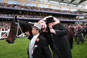 Images Dated 23rd June 2012: Luke Nolan kisses Peter Moody after Black Caviars victory at Royal Ascot