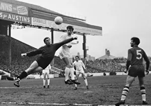 Manchester City goalkeeper Alan Ogley attempts to punch clear from Ipswichs Gerry Baker