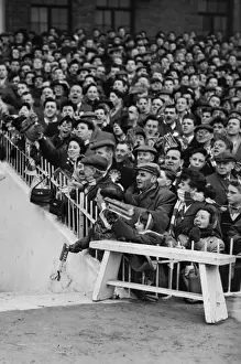 Supporters Prints: Manchester United fans cheer their team onto the field before the 1958 FA Cup semi-final