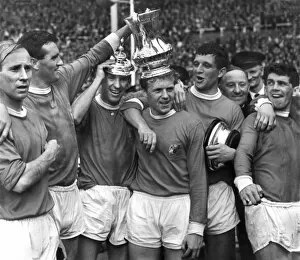 Soccer Collection: Manchester United players celebrate after winning the FA Cup in 1963