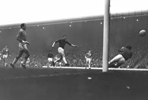 Images Dated 14th February 2012: Manchester Uniteds David Herd scores against Liverpool in 1964 / 5