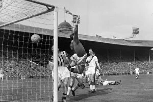 1957 FA Cup Final - Aston Villa 2 Manchester United 1 Collection: Manchester Uniteds Tommy Taylor scores in the 1957 FA Cup Final