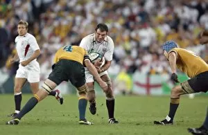 2003 Rugby World Cup Final Collection: Martin Johnson takes the ball into contact during the 2003 World Cup Final