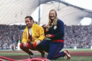 Images Dated 11th August 2010: Mary Peters shows off her gold medal with coach Buster McShane at the 1972 Munich Olympics